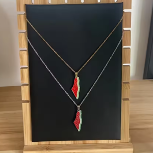 necklace and earrings with a design of the map of palestine